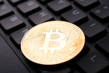 Closeup of bitcoin at keyboard
