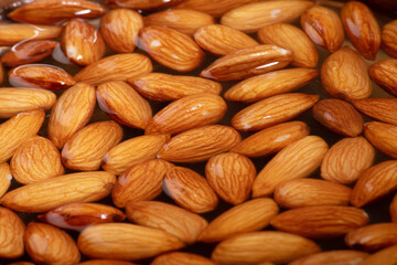 Closeup of soaked almonds texture background