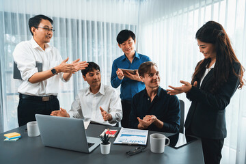Excited and happy office worker employee celebrate after make successful strategic business marketing planning. Teamwork and positive attitude create productive and supportive workplace. Prudent