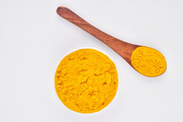 Top view of turmeric powder on white background