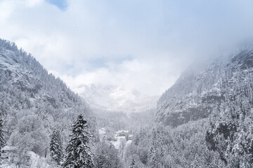 Scenic view of mountains near Hallstatt in Austria during snow fall in winter
