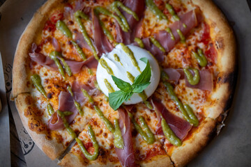 Delicious home baked Italian style pizza close up photography