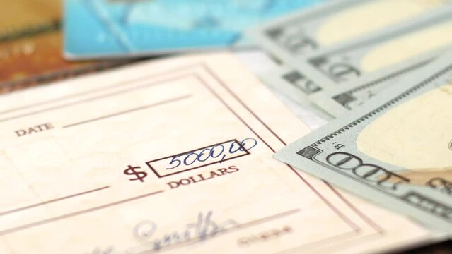 Check Financial Payment, bank credit cards, cash money and bitcoin on table, Paycheck Or Payroll Check