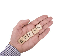 the word Dreams on the palm of a male hand