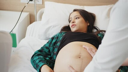 Antenatal care. Female doctor family therapist ob-gyn support comfort help young pregnant woman patient. Medic worker touching hand of expectant mother caressing her belly on checkup. Close up view. - Powered by Adobe