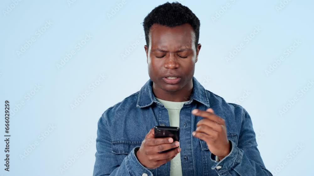 Poster black man in studio with phone and frustrated reading post, message or notification with connection 