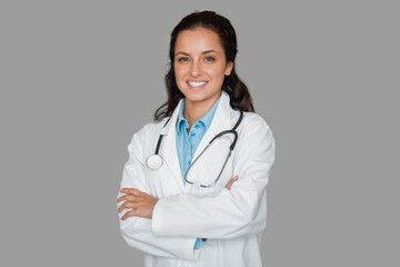 Smiling female doctor with stethoscope, arms crossed