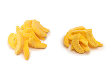 Juicy colorful jelly banana sweets isolated on white.