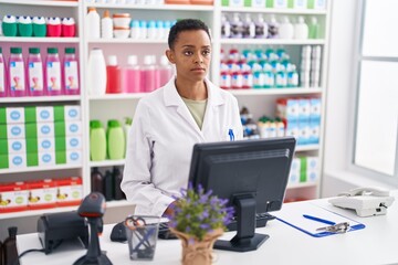 African american woman pharmacist using computer at pharmacy