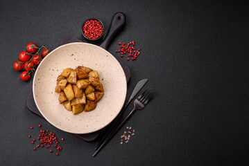 Delicious crispy fried potato wedges with salt, spices and herbs