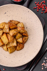 Delicious crispy fried potato wedges with salt, spices and herbs