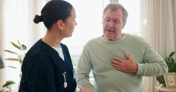 Doctor, heart attack and man with emergency in home, massage chest and cardiovascular problems. Pain, senior person and family history of blood disease, anxiety and living room with nurse for help