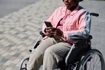 High angle view of African American woman with disability walking outdoors