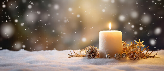 White burning advent candle as panorama background