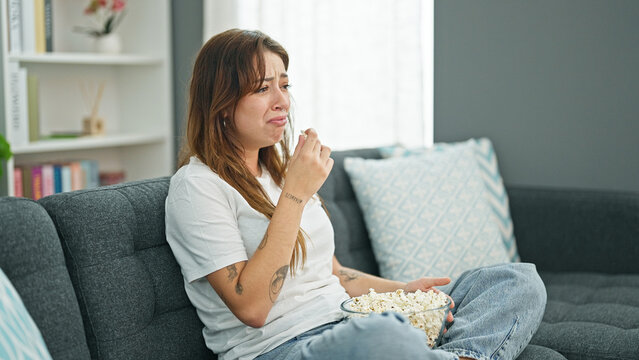 Young Beautiful Hispanic Woman Watching Drama Movie Crying At Home