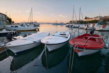 Marina with moored boats in the Croatian town of Malinska on the