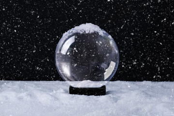 Christmas magical snow globe empty inside for your design. Christmas or New Year greeting card. Snow globe on snowy background. - 666072440