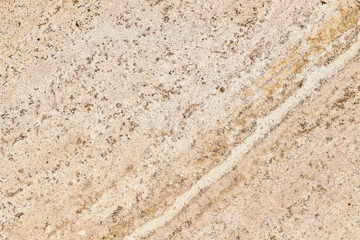 polished tile from Armenian tuff on wall of urban house close up in Yerevan city