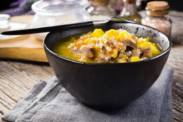 Polish barley soup with vegetables and chicken heart.