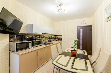 interior apartment kitchen and dining room, refectory area, cooking equipment, table furniture, stove