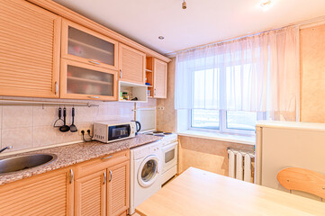 interior apartment kitchen and dining room, refectory area, cooking equipment, table furniture, stove