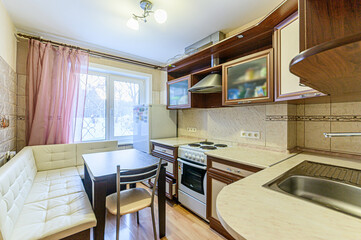 interior apartment kitchen and dining room, refectory area, cooking equipment, table furniture, stove