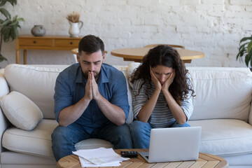 Upset concerned couple of homeowners, renters, bank customers overwhelmed with bad news, having finance loss, money troubles, getting too high mortgage, loan monthly fees - obrazy, fototapety, plakaty