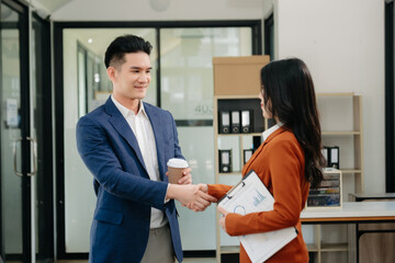 Fototapeta premium Business partnership handshake concept.Photo two coworkers handshaking process.Successful deal after great meeting..