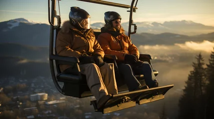 Fotobehang A couple on a chairlift on the mountains in winter. Ski lift, ski resort, ski slope. Snowboarders on a chairlift. © Lara