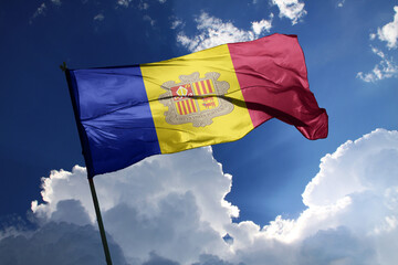 national flag of Andorra waving in the wind on a clear day. - obrazy, fototapety, plakaty