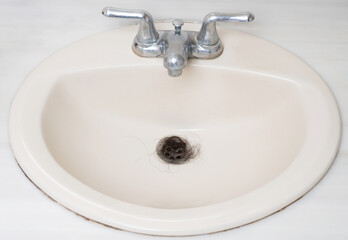 Nasty human hair in sink drain
