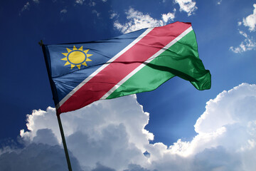 national flag of Namibia waving in the wind on a clear day.