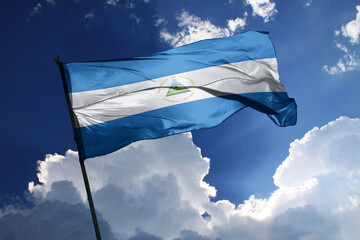 national flag of Nicaragua waving in the wind on a clear day.
