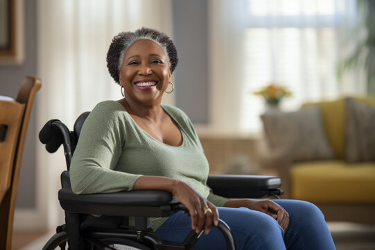 Happy Older African American Woman In A Wheelchair In A Nursing Home, Enjoying Life