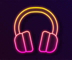 Glowing neon line Headphones icon isolated on black background. Earphones. Concept for listening to music, service, communication and operator. Vector