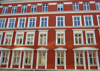 Fototapeta na wymiar beautiful old terracotta colored house with white windows in Copenhagen