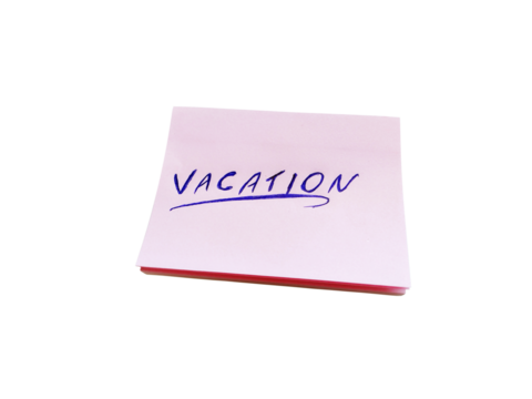 Isolated notepad written the word vacation