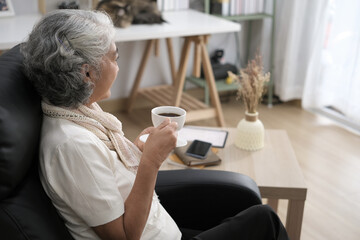 Portrait of a senior woman enjoying a cup of coffee at home
