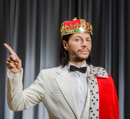 Funny king wearing crown in coronation concept