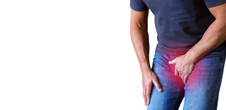 Pain in the groin, the man covered his groin with his hands. The focus of inflammation is marked in red. Space for copying.