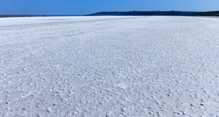covered with a layer of white self-precipitating common salt