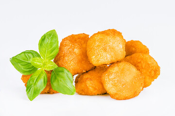 Chicken Breaded Fillet.Fast food. Breaded Chicken Inner Fillet on a White Background,Chicken Breaded Raw Meat. Fast cooking. Breaded chicken nuggets. Homemade food at home.