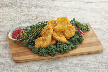 Crispy chicken nuggets with tomato ketchup