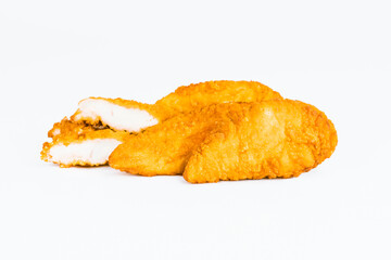 Fast food. Breaded Chicken Inner Fillet on a White Background,Chicken Breaded Raw Meat. Fast cooking. Breaded chicken nuggets. Homemade food at home. Chicken Breaded Fillet.