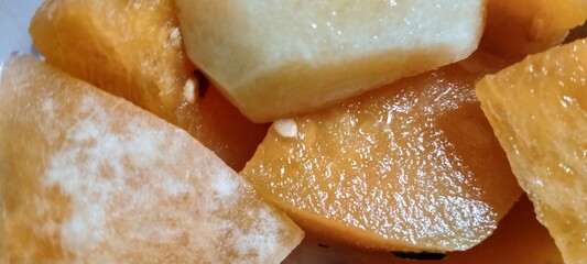 fresh slices of watermelon placed in a transparent plastic box