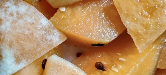 fresh slices of watermelon placed in a transparent plastic box
