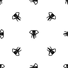 Seamless pattern of repeated black elephant heads. Elements are evenly spaced and some are rotated. Vector illustration on white background