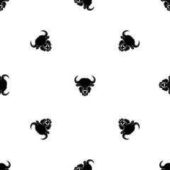 Seamless pattern of repeated black buffalo heads. Elements are evenly spaced and some are rotated. Vector illustration on white background