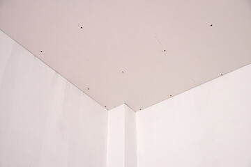 Corner room with gypsum board on ceiling before plaster interior build gypsum board ceiling...