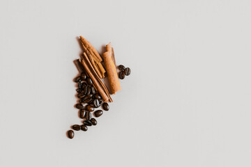 Coffee beans and cinnamon. Caption space.